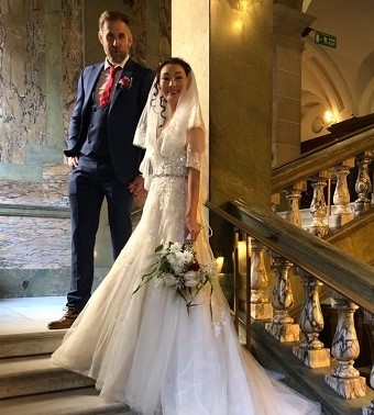 a picture of two people stood in Guildhall