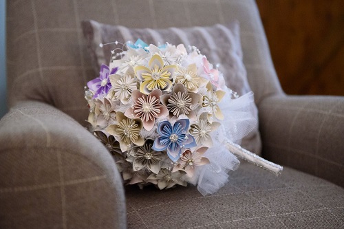 paper wedding flowers on a sofa